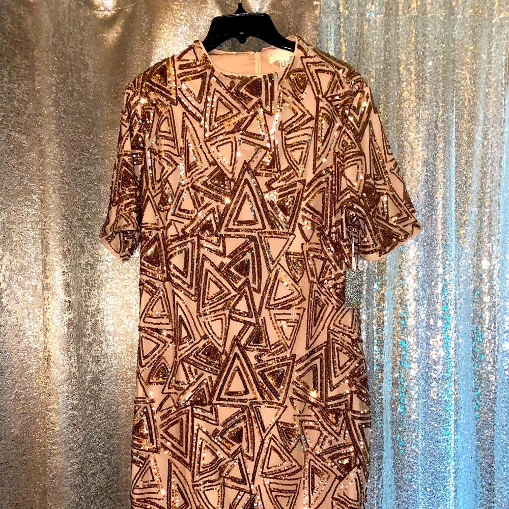 Sparkle in this cute little number. Great for a celebration/date night